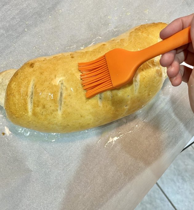 brushing butter on bread